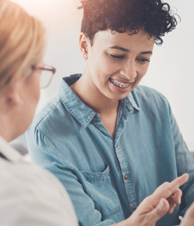 Patient and dental team member reviewing information