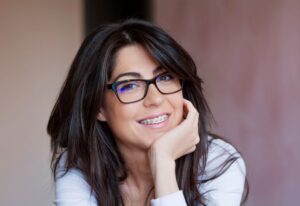 Portrait of confident woman with braces