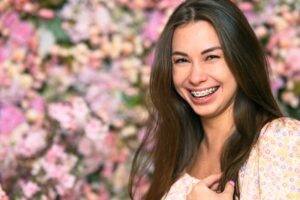 Smiling young woman wearing braces